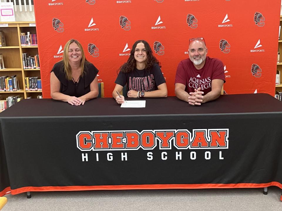 Cheboygan's Kenzie Burt will continue her basketball career at Aquinas College this upcoming season. In this photo with Burt are her parents, Kristin Gilbert (Burt) and Michael Burt.