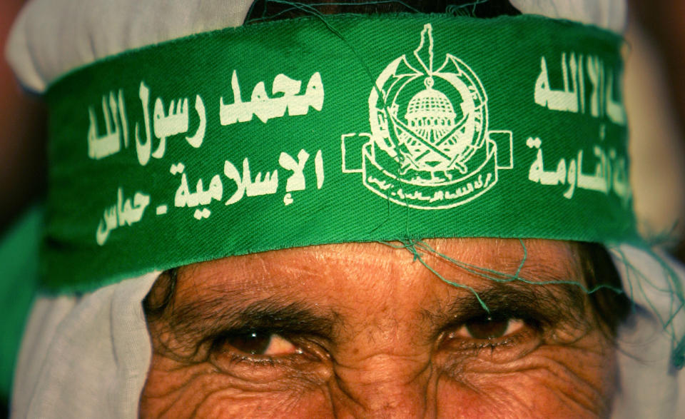 A Palestinian woman wears a Hamas banner on her forehead during Hamas's celebrations of the Israeli pullout from Gaza in 2005.