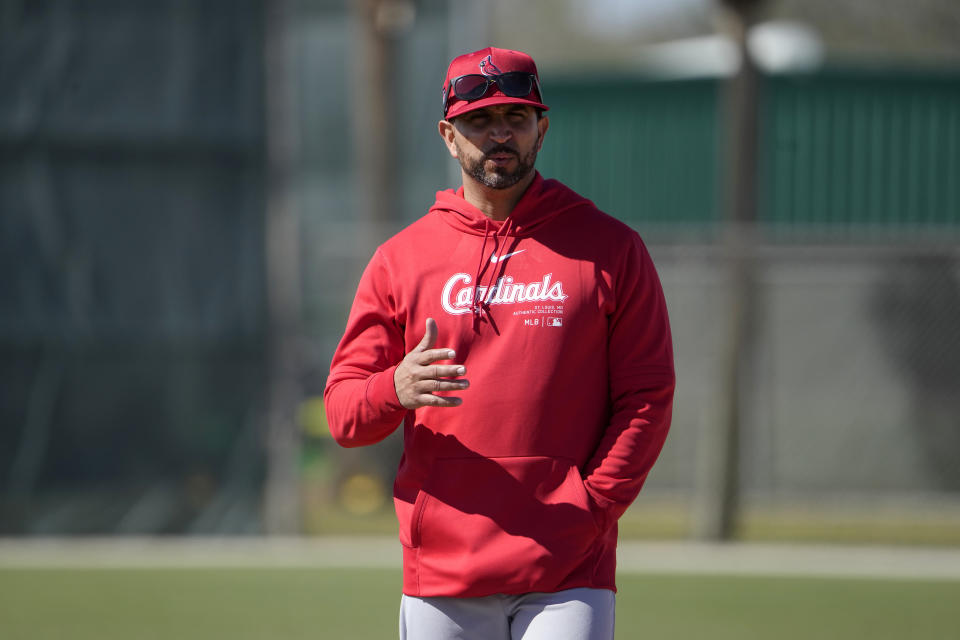 St. Louis Cardinals manager Oliver Marmol roams the field during a spring training baseball workout Wednesday, Feb. 21, 2024, in Jupiter, Fla. (AP Photo/Jeff Roberson)