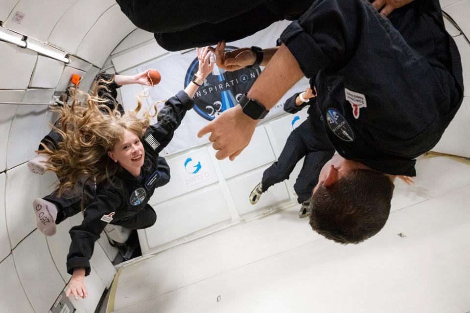 Hayley Arceneaux (left) and the rest of the Inspiration4 crew on a ZERO-G flight in Las Vegas on July 11, 2021. The plane flies in parabolic arcs to simulate zero gravity.<span class="copyright">John Kraus—Inspiration4</span>