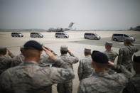 <p>U.S. soldiers salute to vehicles transporting the remains of 55 U.S. soldiers who were killed in the Korean War at Osan Air Base in Pyeongtaek, South Korea, Friday, July 27, 2018. (Photo: Kim Hong-Ji/Pool Photo via AP) </p>