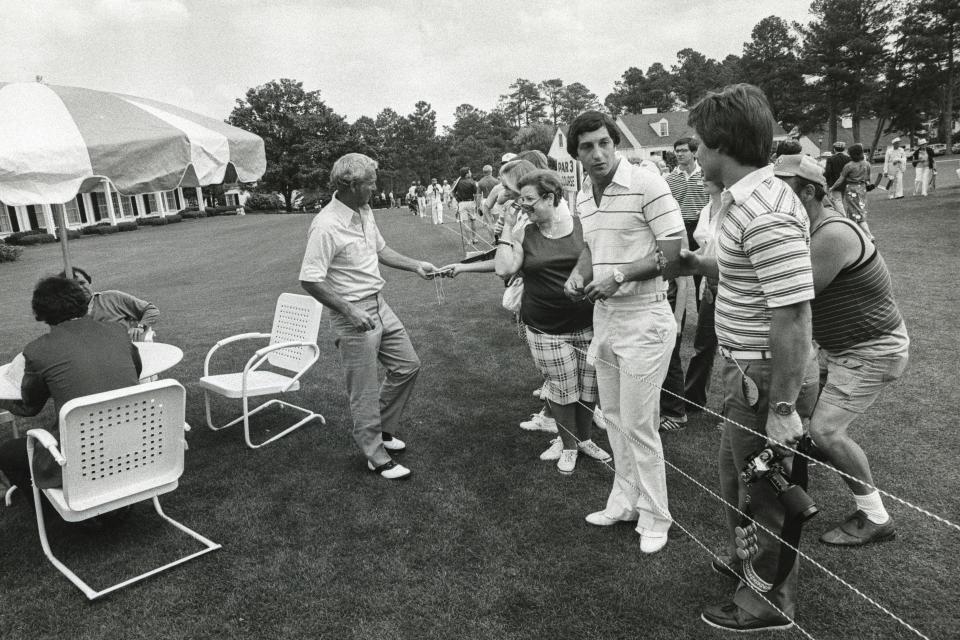 Arnold Palmer greets spectators at Augusta National Golf Club.