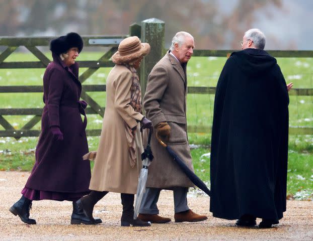 <p>Max Mumby/Indigo/Getty</p> King Charles and Queen Camilla walk from St Mary Magdalene near Sandringham House on Dec. 3.