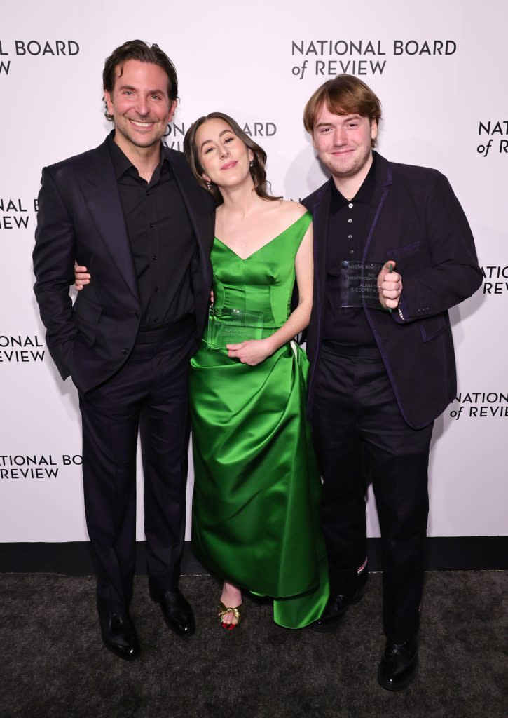 Bradley Cooper, Alana Haim, and Cooper Hoffman pose at the National Board of Review gala at Cipriani 42nd Street in New York City on March 15, 2022. - Credit: Getty Images for National Board