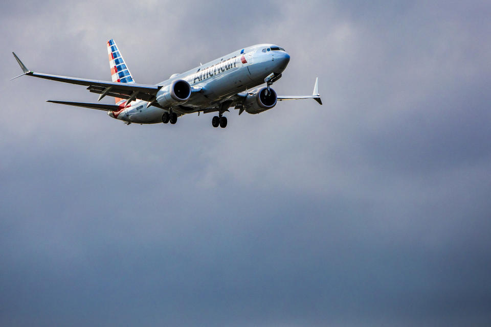 An American Airlines Group Inc. Boeing Corp. 737 Max 8 aircraft approaches to land at Miami International Airport (MIA) in Miami, Florida, U.S., on Tuesday, March 12, 2019. Since shortly after the dawn of the jet age, the world has followed the U.S.'s lead on aviation safety. Now, in a remarkable rebuke, nations from the U.K. to Australia have rejected public reassurances from the Federal Aviation Administration and grounded Boeing Co.'s 737 Max jet. Photographer: Scott McIntyre/Bloomberg via Getty Images