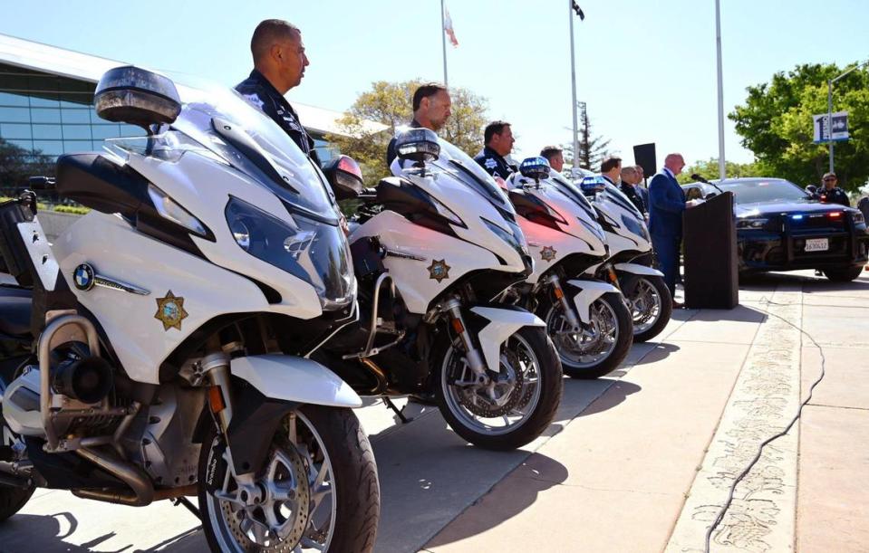 Motorcycle poice officers stand alonsde a press conference where a proposed ordinance would fine those who attend to watch as well as participate in any sideshow in the city Wednesday, April 19, 2023 in front of Fresno City Hall.