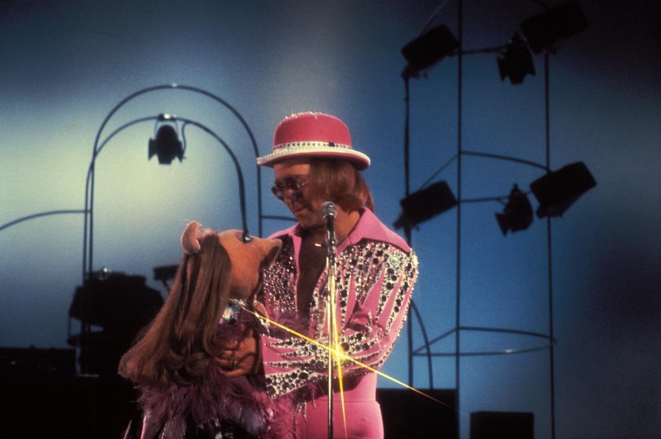 John performs with Miss Piggy on "The Muppet Show."