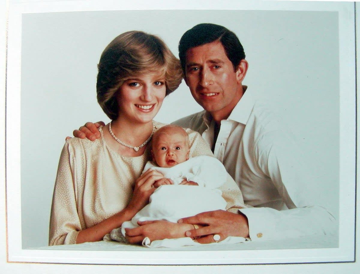 Royal Christmas card bearing a full-color family photograph of Prince Charles, Princess Diana, and the infant Prince William from 1982 (PA)