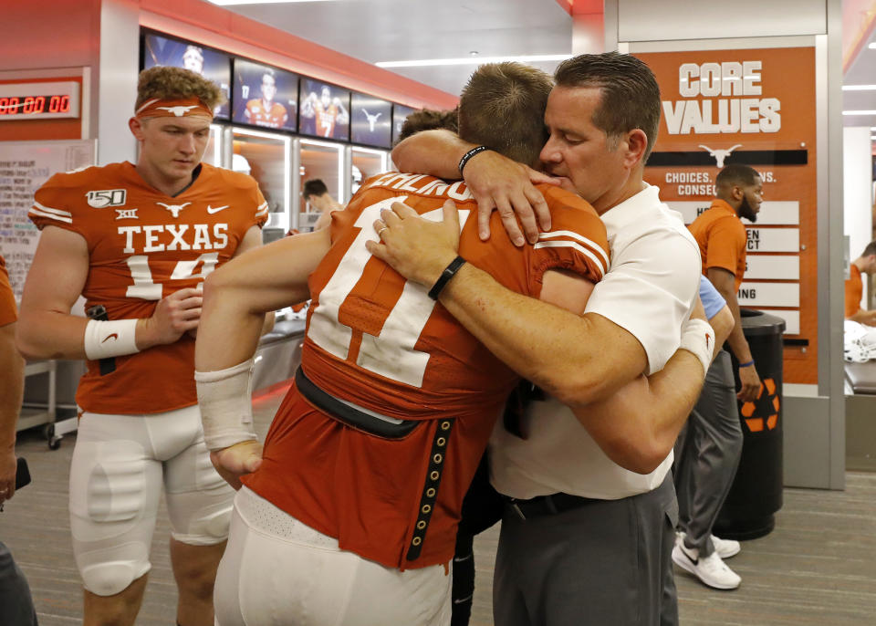 Texas Longhorns offensive coordinator Tim Beck hugs quarterback Sam Ehlinger after their 45-38 loss to the LSU Tigers Saturday Sept. 7, 2019 at Darrell K Royal-Texas Memorial Stadium in Austin, Tx. ( Photo by Edward A. Ornelas )