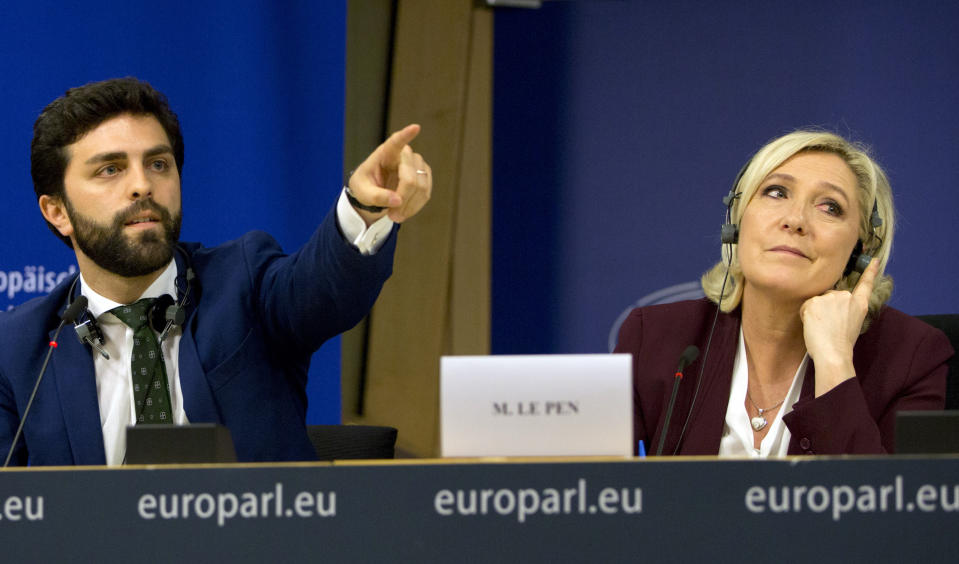 French far-right National Rally leader and MEP Marine Le Pen, right, and Italy's Lega party member and MEP Marco Zanni attend a media conference to announce the formation of a new far-right European Parliament group at the European Parliament in Brussels, Thursday, June 13, 2019. (AP Photo/Virginia Mayo)