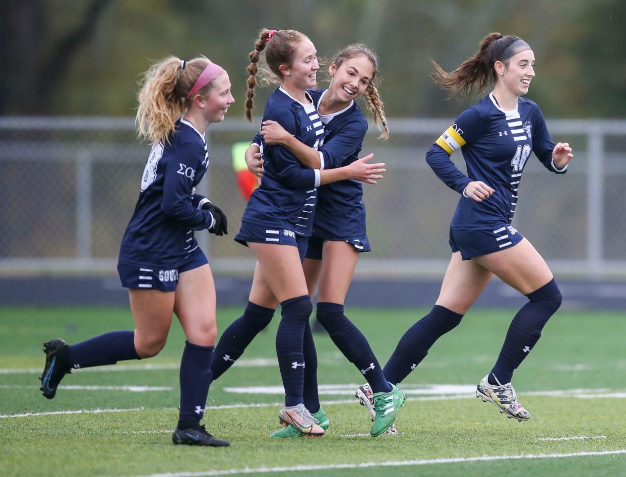 South Oldham's Marley Kahle (18) gets hugged by Betsy Huckaby after she scored her second goal within one minute of play in the girls semi state game in Lexington Thursday. The Lady Dragons went up 3-0 early in the first half before defeating the Lady Colonels with a final score of 5-0. Oct. 28, 2021