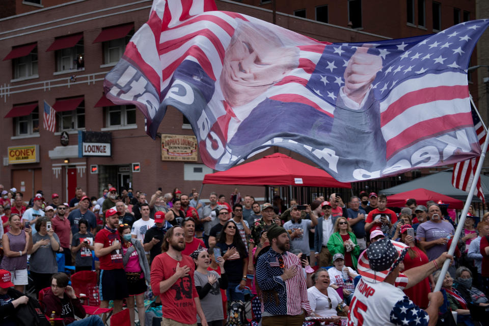 TOPSHOT - People wait to attend a rally with US President Donald Trump this evening at the BOK Center on June 20, 2020, in Tulsa, Oklahoma. (Photo by Brendan Smialowski / AFP) (Photo by BRENDAN SMIALOWSKI/AFP via Getty Images)