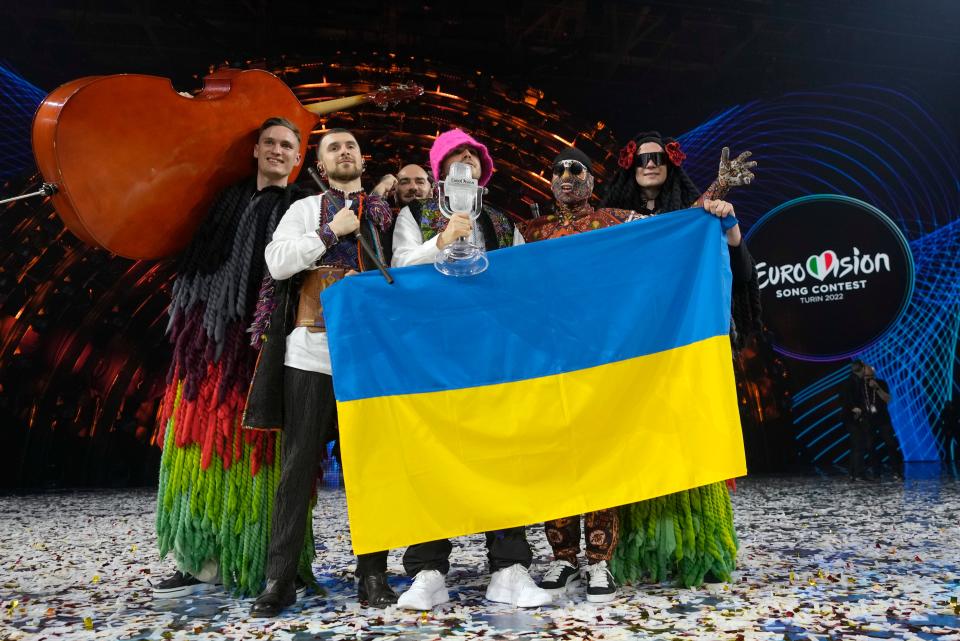 The Kalush Orchestra from Ukraine celebrate after winning the Eurovision Song Contest in Turin on 14 May ((Luca Bruno/AP))