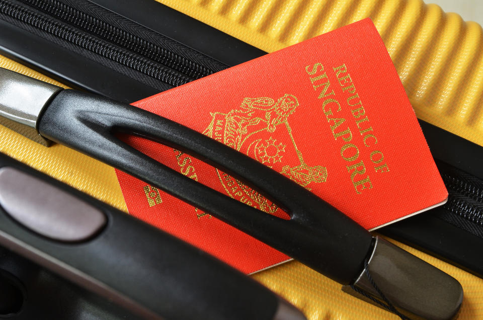 A Singapore passport on a luggage. (PHOTO: Getty Images)