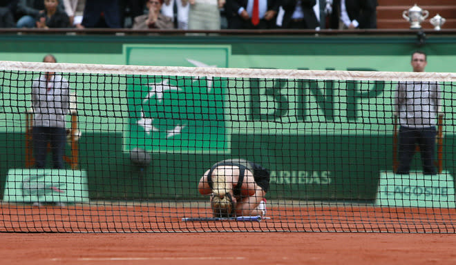 Russia's Maria Sharapova reacts after winning over Italy's Sara Errani during their Women's Singles final tennis match of the French Open tennis tournament at the Roland Garros stadium, on June 9, 2012 in Paris. AFP PHOTO / CYRILLE CADETCYRILLE CADET/AFP/GettyImages