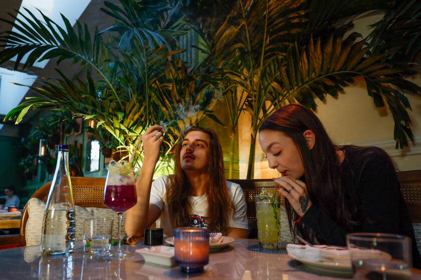 Blake Evans and Brooke Ann share a smoke and a meal at Irie.