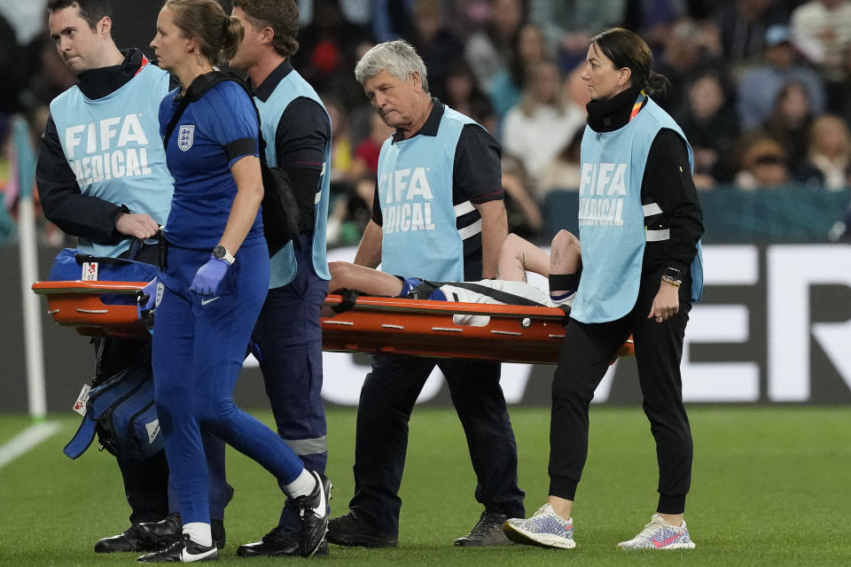 Medical staff stretcher England's Keira Walsh off the pitch after she was injured during the Women's World Cup Group D soccer match between England and Denmark at the Sydney Football Stadium in Sydney, Australia, Friday, July 28, 2023. (AP Photo/Mark Baker)