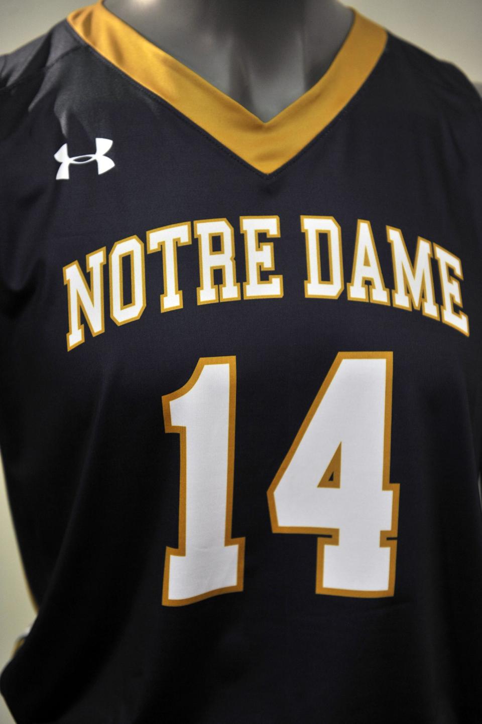 A new Notre Dame basketball uniform is displayed at a news conference Tuesday Jan. 21, 2014, in South Bend, Ind., announcing an agreement between Notre Dame and Under Armour that will outfit the university's athletic teams (AP Photo/Joe Raymond)