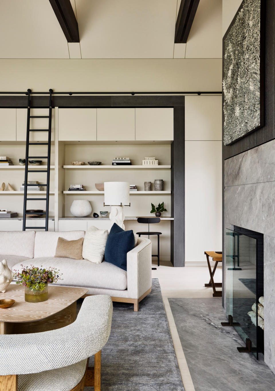 A neutral living room with an oatmeal sofa with subtle neutral contrast piping