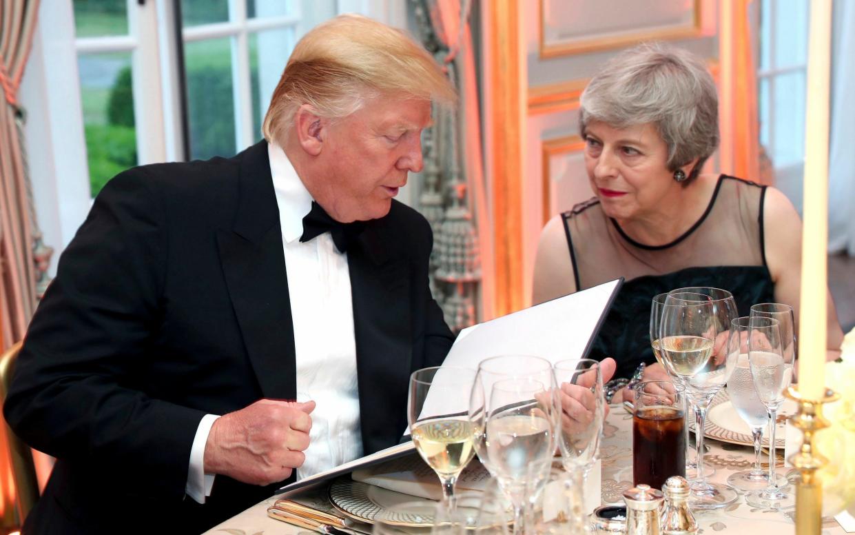 Donald Trump, seen here dining with Theresa May in 2019, is inviting supporters to a private candlelit dinner with him after Tuesday's court appearance - Chris Jackson/AP