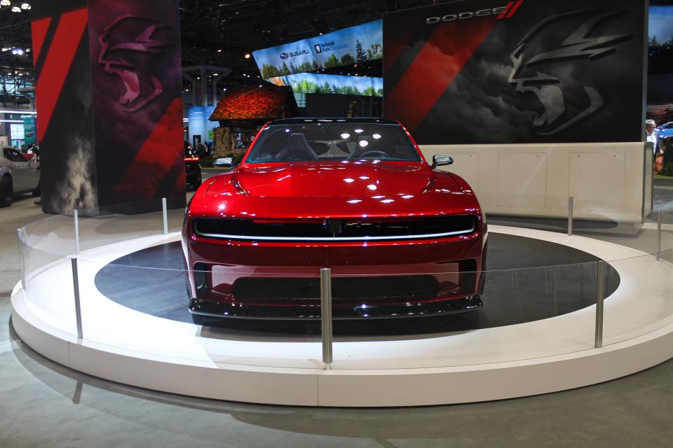 A red Dodge Charger Daytona SRT concept, seen from the front.