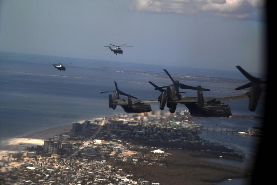 US President Joe Biden and US First Lady Jill Biden survey storm-ravaged areas via helicopter en route to Fishermans Wharf in Fort Myers on Wednesday.