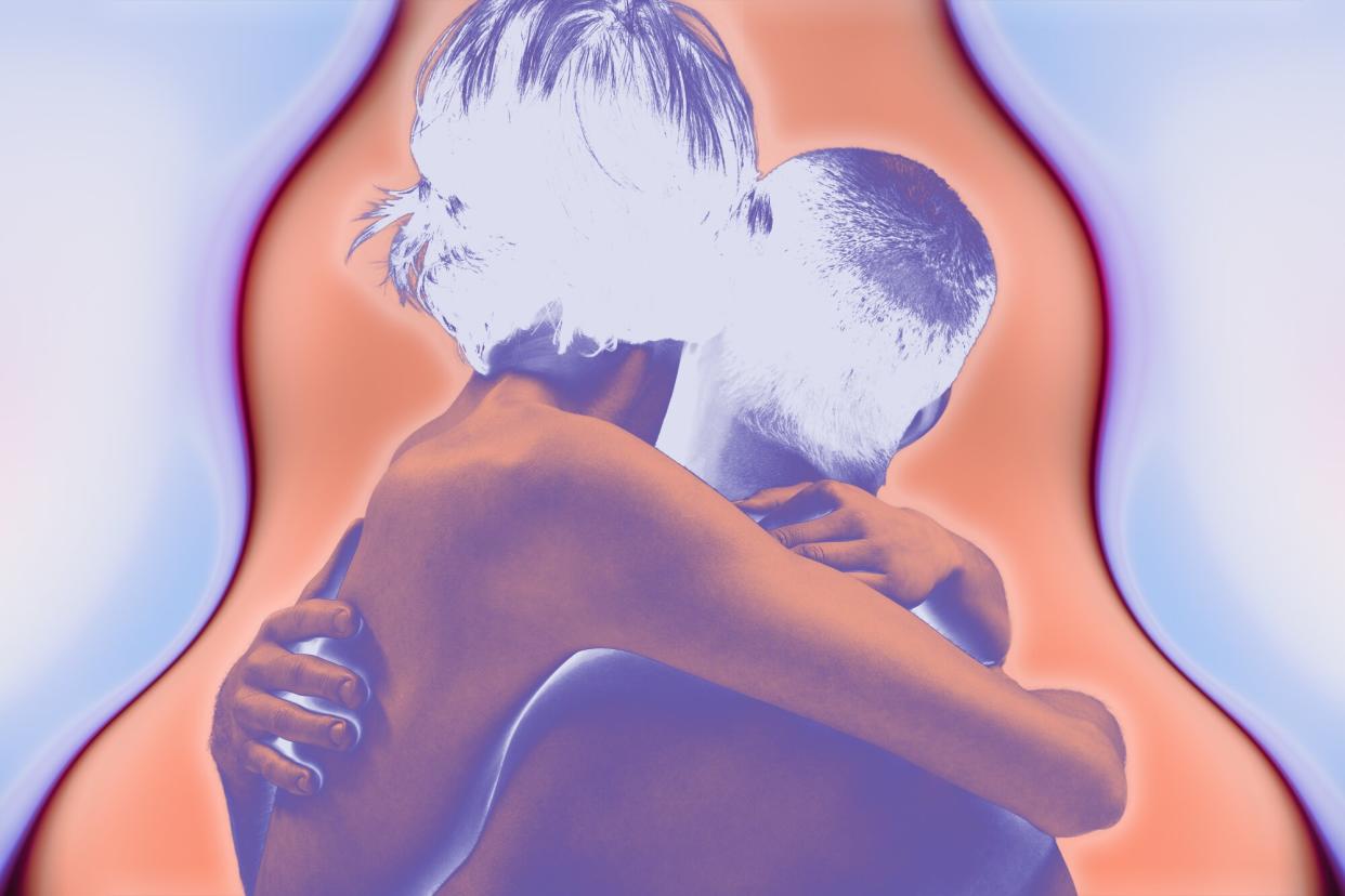 A naked couple embracing