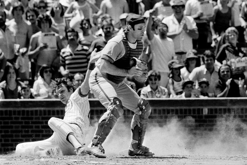 FILE - Chicago Cubs first baseman Larry Biittner scores behind New York Mets catcher John Stearns during the first inning of a baseball game in Chicago, on June 26, 1978. . Stearns, a four-time time All-Star catcher with the New York Mets, has died after a long battle with cancer, the Mets announced Friday, Sept. 16, 2022. He was 71. (AP Photo/Larry Stoddard, File)