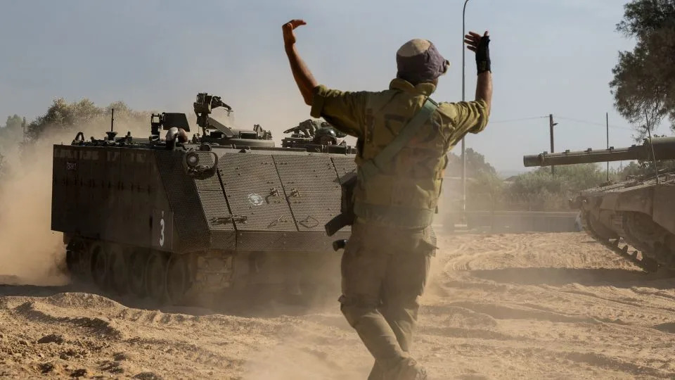 An IDF soldier guides an armored personnel carrier in southern Israel on October 21, 2023. - Alexi J. Rosenfeld/Getty Images