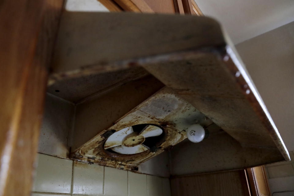 The oven vent inside Carrie Newson's home at the Dutch Village apartments is seen corroded with mildew, Tuesday, July 30, 2019, in Baltimore. Newson has complained to management about mice and mold in her home but the issues have yet to be fixed. The apartment complex is owned by Jared Kushner, son-in-law of President Donald Trump, who days earlier vilified Congressman Elijah Cummings' majority-black Baltimore district as a "disgusting, rat and rodent infested mess" where "no human being would want to live." (AP Photo/Julio Cortez)