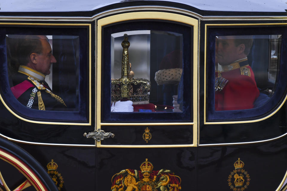 The Imperial State Crown is carried to parliament by carriage ahead of the State Opening of Parliament ceremony in London, Monday, Oct. 14, 2019. (AP Photo/Alberto Pezzali)