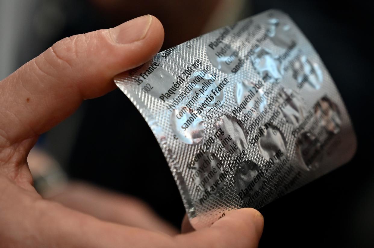 Medical staff shows a packet of Plaqueril, tablets containing hydroxychloroquine, drug that has shown signs of effectiveness against coronavirus, at the IHU Mediterranee Infection Institute in Marseille on February 26, 2020.  The Mediterranee infection Institute in Marseille based in La Timone Hospital is at the forefront of the prevention against coronavirus in France. (Gerard Julian/ AFP via Getty Images)