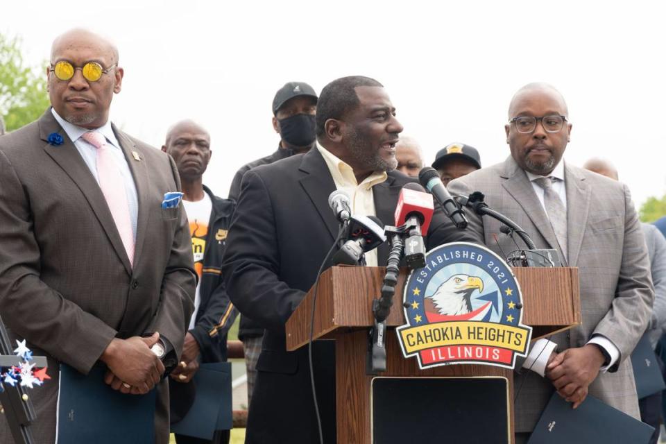 From left to right, East St. Louis NAACP Vice President George McClellan, Cahokia Heights Mayor Curtis McCall Sr. and East St. Louis Mayor Robert Eastern III attend a news conference calling for the U.S. Army Corps of Engineers to help the communities address chronic flooding.