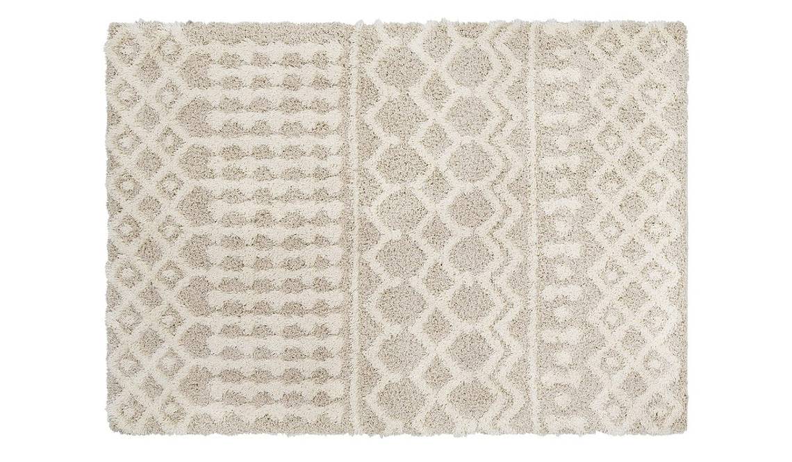 This neutral rug features an elegant and subtle design with durable, machine-woven fabric.