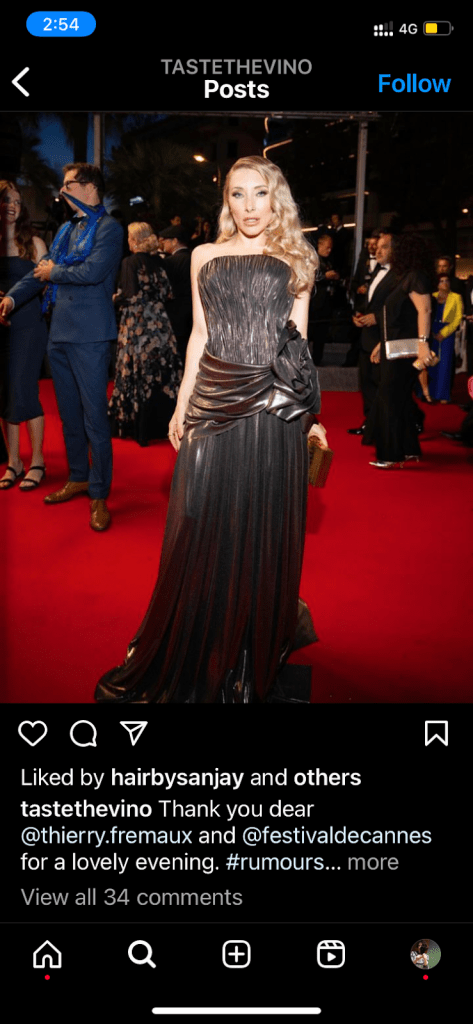 Actress Alexandra Vino wearing a dark metallic strapless dress on the red carpet in Cannes