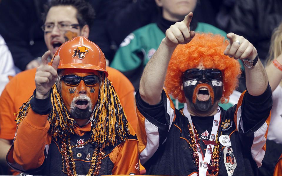 VANCOUVER, CANADA - NOVEMBER 27: Fans of the B.C. Lions celebrate a play against the Winnipeg Blue Bombers during the CFL 99th Grey Cup November 27, 2011 at BC Place in Vancouver, British Columbia, Canada. (Photo by Jeff Vinnick/Getty Images)