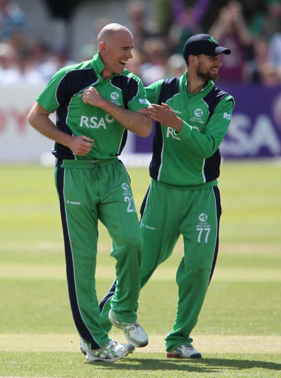 Ireland's Trent Johnson (L) celebrates during a cricket match between Pakistan and Ireland on May 26, 2013. Tuesday's game will be Johnston's last before he retires from international cricket at the end of the year