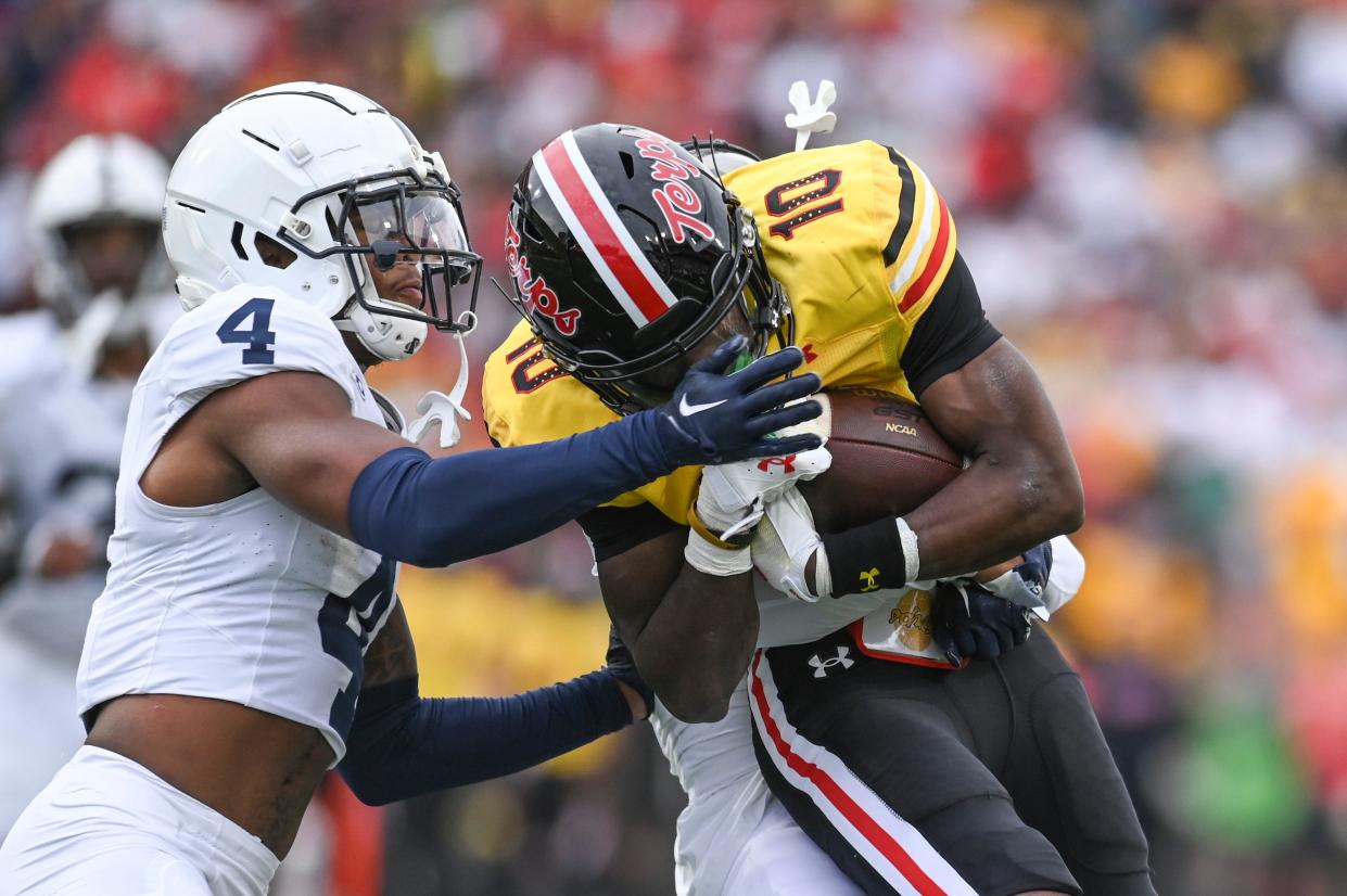 Nov 4, 2023; College Park, Maryland, USA; Maryland Terrapins wide receiver Tai Felton (10) is tackles by Penn State Nittany Lions cornerback Kalen King (4) and P cornerback Johnny Dixon (3) during the first half at SECU Stadium. Mandatory Credit: Tommy Gilligan-USA TODAY Sports