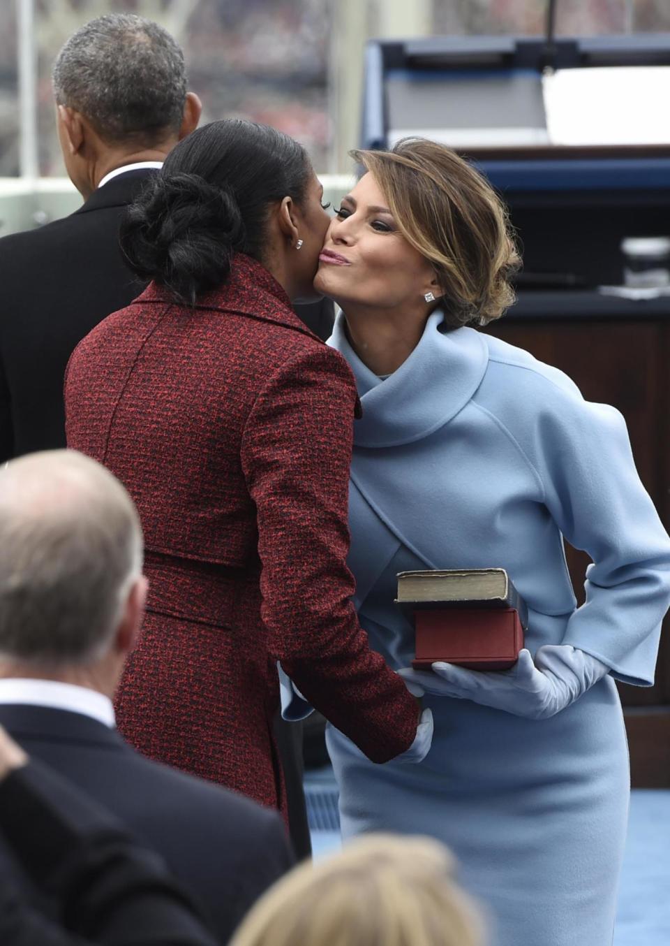 First Lady Melania Trump kisses former First Lady Michelle Obama at the Presidential Inauguration of Donald Trump (Getty Images)