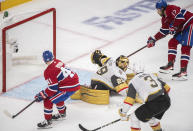 Montreal Canadiens' Josh Anderson (17) scores against Vegas Golden Knights goaltender Marc-Andre Fleury as Canadiens' Paul Byron and Knights' Brayden McNabb (3) look for the rebound during overtime in Game 3 of an NHL hockey semifinal series, Friday, June 18, 2021, in Montreal. (Graham Hughes/The Canadian Press via AP)