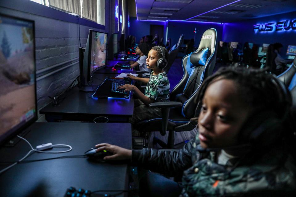 Detroit students Orion Williams and Jacob Ritchie play Fortnite as part of an after-school enrichment program.