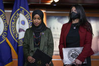 Rep. Ilhan Omar, D-Minn., left, joined by Rep. Rashida Tlaib, D-Mich., pauses before speaking to reporters in the wake of anti-Islamic comments made last week by Rep. Lauren Boebert, R-Colo., who likened Omar to a bomb-carrying terrorist, during a news conference at the Capitol in Washington, Tuesday, Nov. 30, 2021. (AP Photo/J. Scott Applewhite)