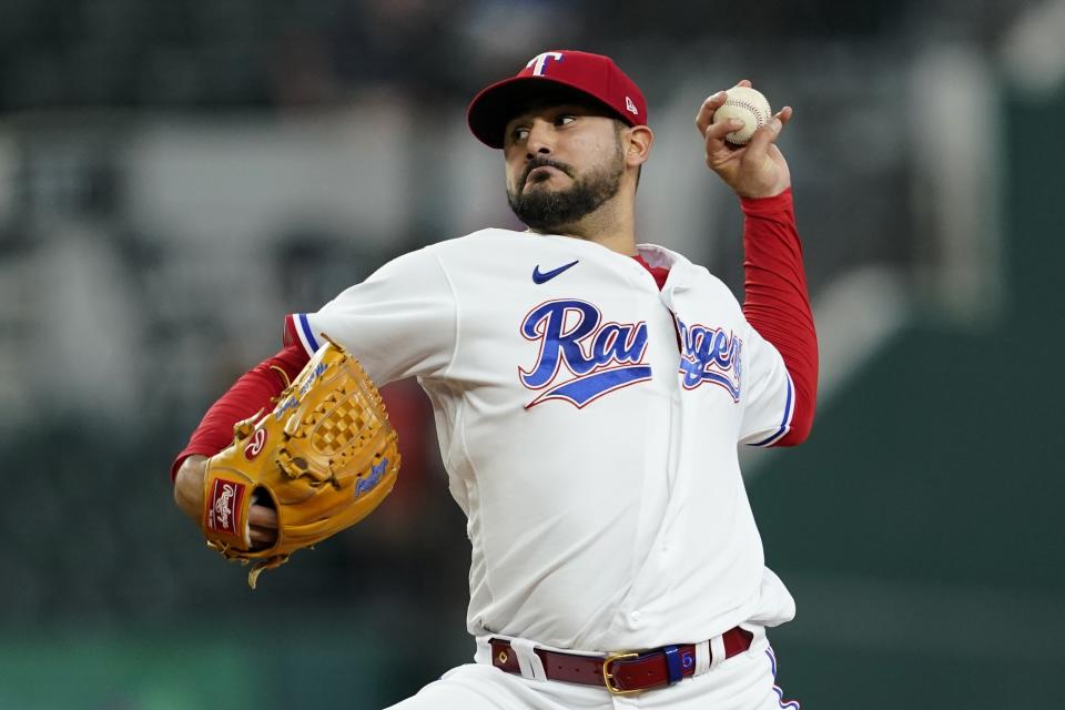 Texas Rangers starting pitcher Martin Perez throws to the Los Angeles Angels in the first inning of a baseball game in Arlington, Texas, Thursday, Sept. 22, 2022. (AP Photo/Tony Gutierrez)