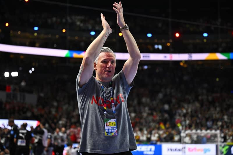 Denmark's coach Nikolaj Jacobsen applauds after the 2024 EHF European Men's Handball semi-finals match between Denmark and Germany at Lanxess Arena. Tom Weller/dpa