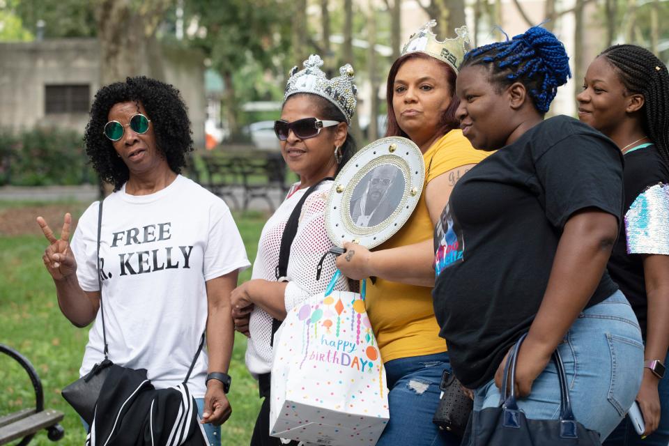 Supporters of R. Kelly arrive at federal court in Brooklyn for his arraignment on sex-crime charges on Aug. 2, 2019, in New York.