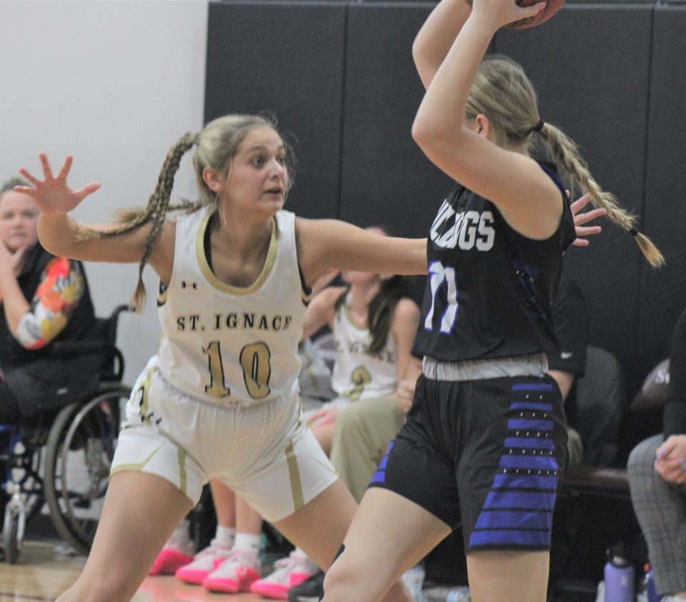 St. Ignace senior Liberty Cullen (10) puts the defensive pressure on Inland Lakes sophomore Mary Myshock during the second half of Monday's regional game at Harbor Light.