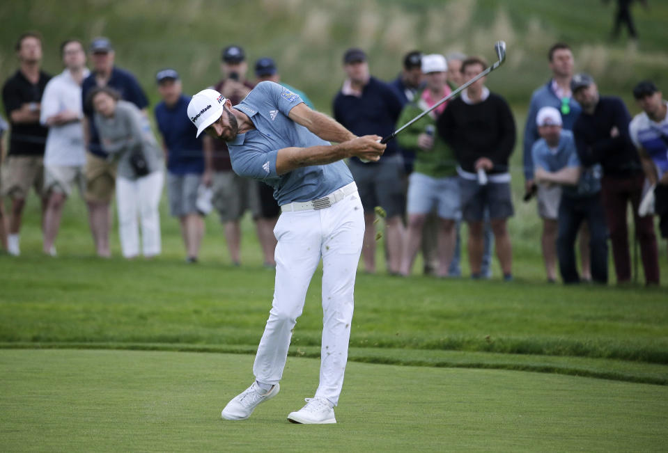 Dustin Johnson hits off the 17th fairway during the final round of the PGA Championship golf tournament, Sunday, May 19, 2019, at Bethpage Black in Farmingdale, N.Y. (AP Photo/Seth Wenig)