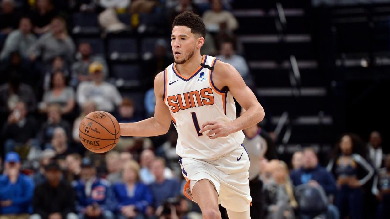 Mandatory Credit: Photo by Brandon Dill/AP/Shutterstock (10540483a)Phoenix Suns guard Devin Booker (1) plays in the second half of an NBA basketball game against the Memphis Grizzlies, in Memphis, TennSuns Grizzlies Basketball, Memphis, USA - 26 Jan 2020.