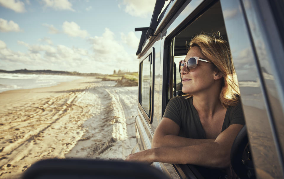 Cropped shot of a woman out on a road trip