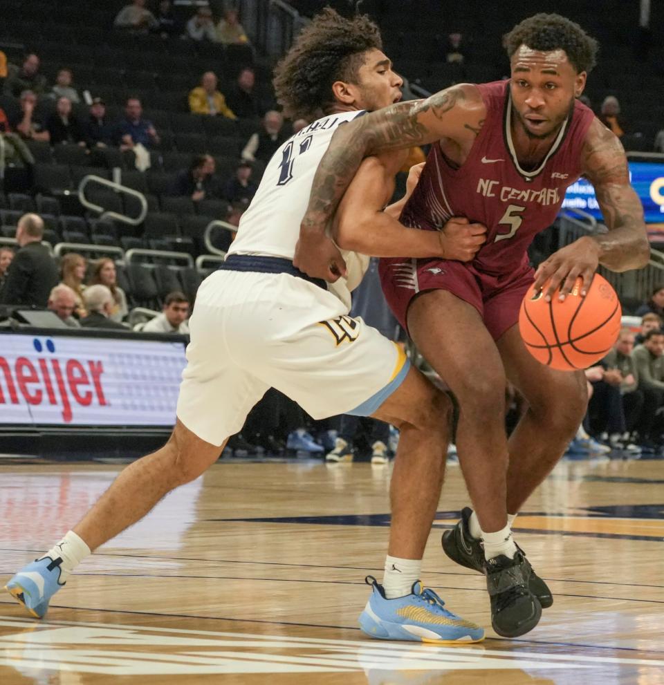 Stevie Mitchell, left, is Marquette's best perimeter defender.